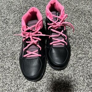 Black and pink Reebok athletic shoes